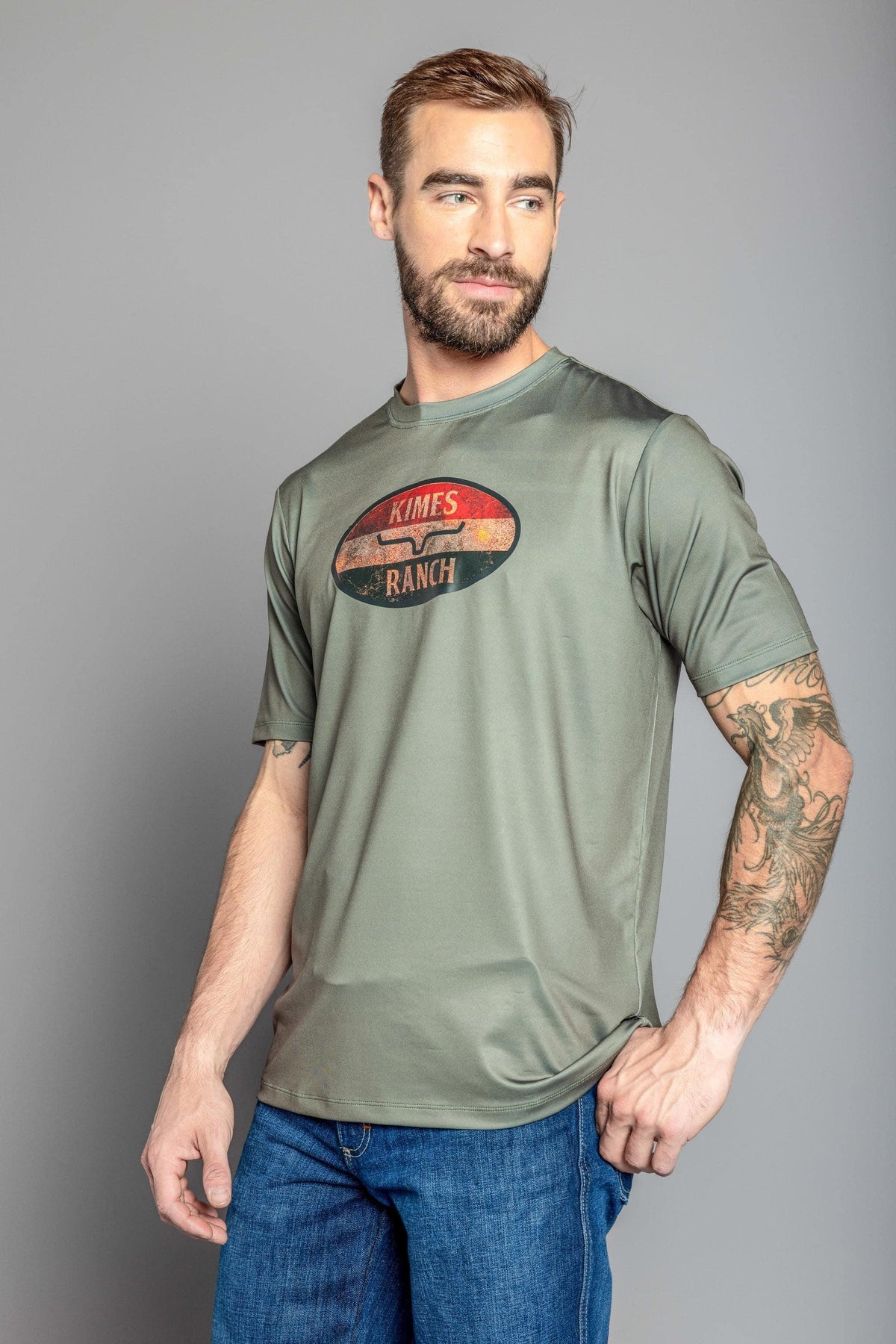 Kimes Ranch American Standard Tech T-Shirt in Sage with a vintage oval graphic and the Kimes Ranch logo