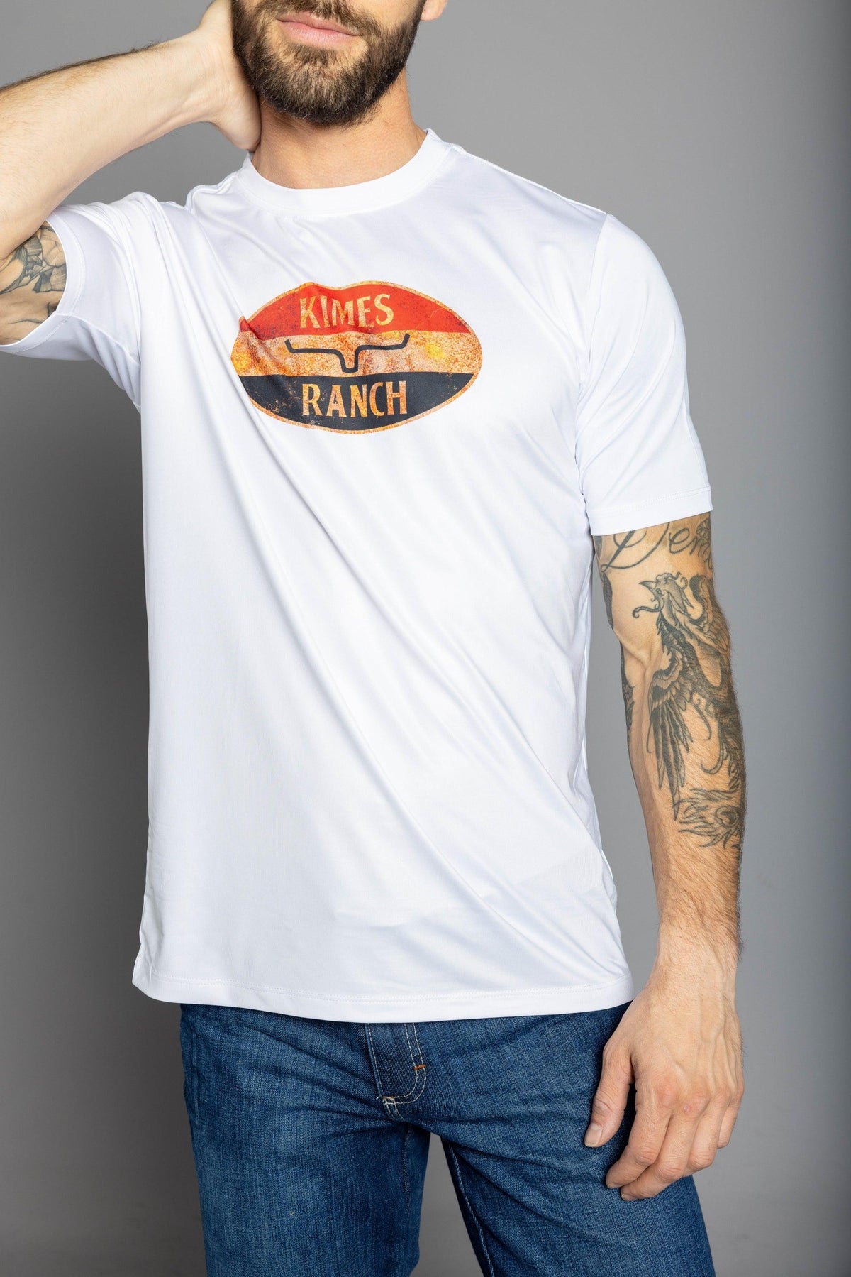 Kimes Ranch American Standard Tech T-Shirt in White with a vintage Kimes Ranch logo graphic on the chest