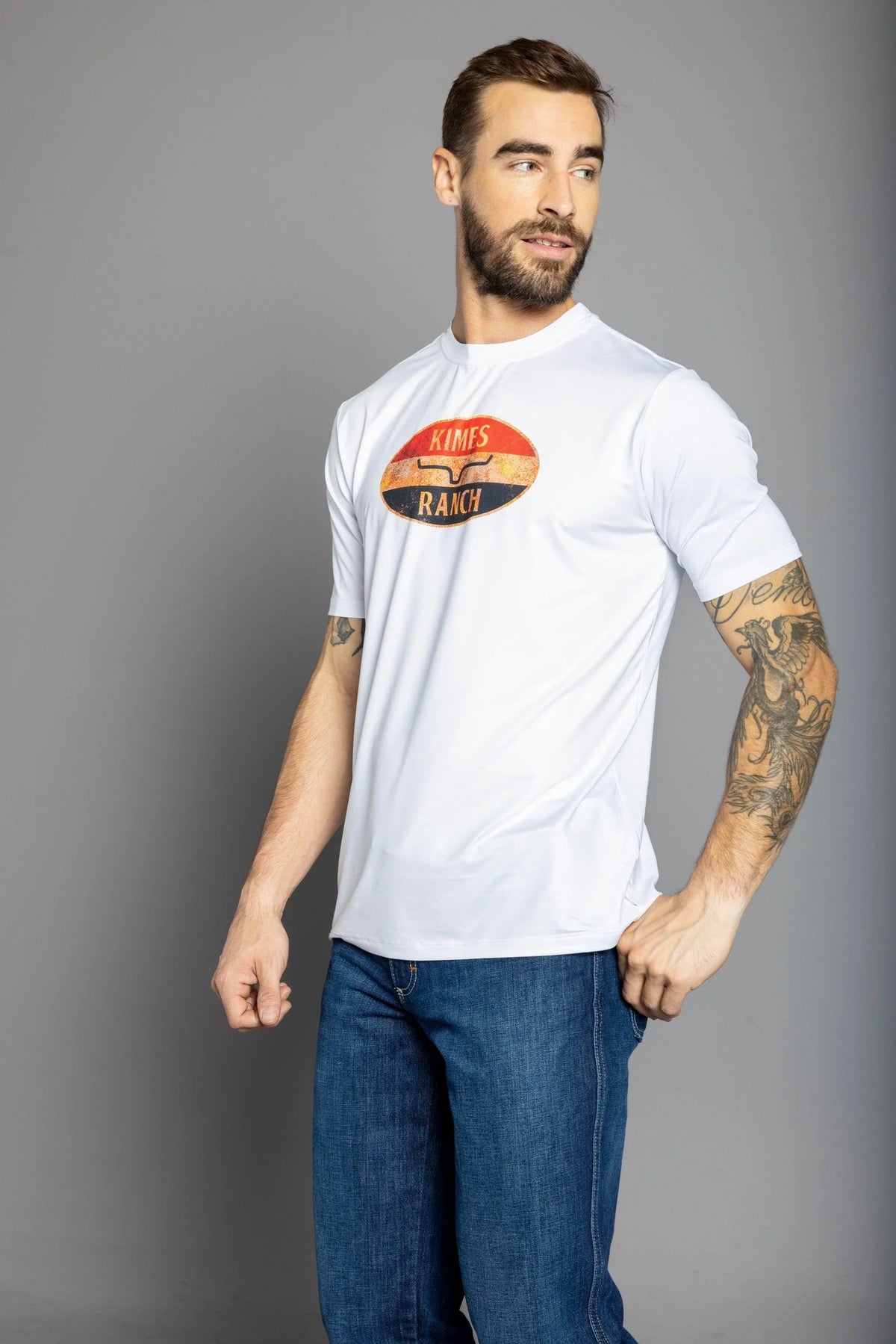 Kimes Ranch American Standard Tech T-Shirt in White with a vintage oval graphic featuring the Kimes Ranch logo