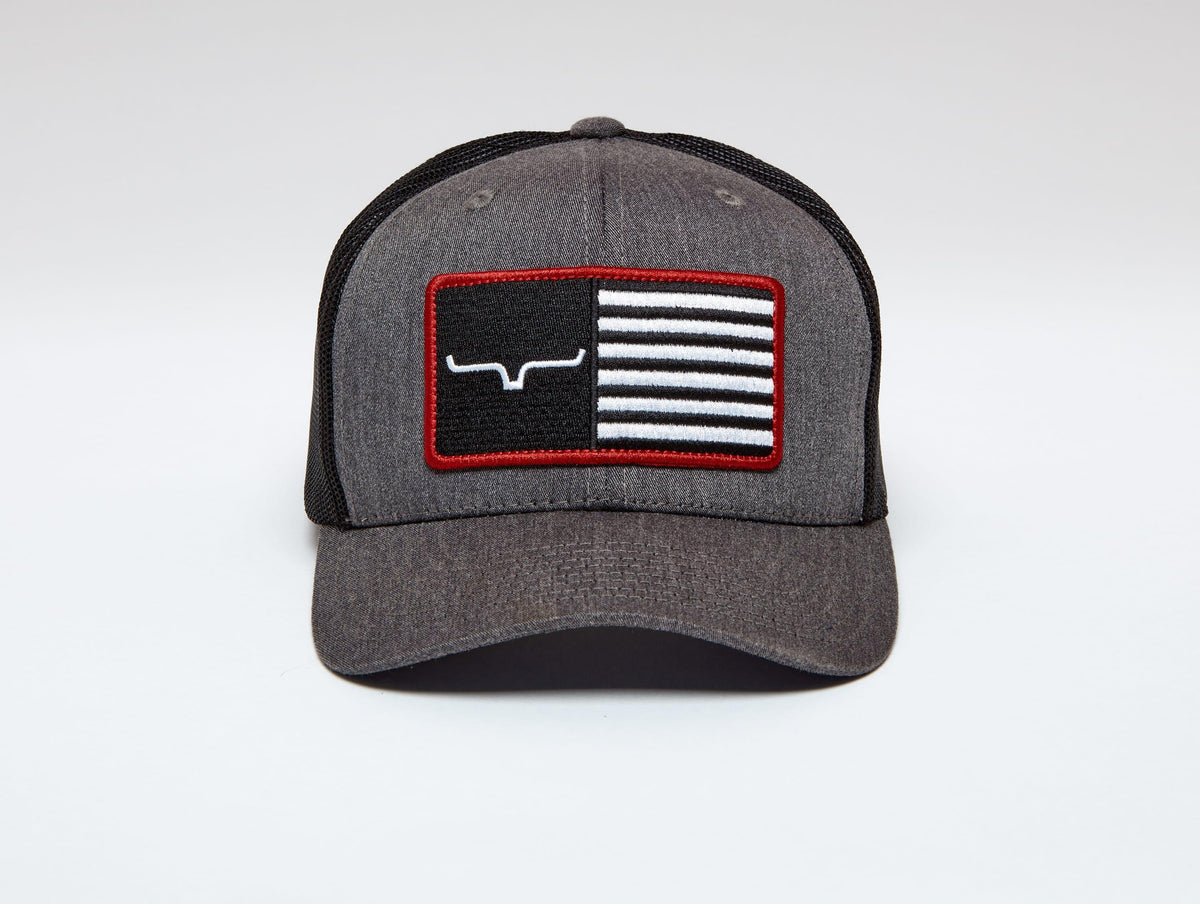 Kimes Ranch American Trucker Hat in Charcoal Heather with a flag patch featuring the Kimes Ranch logo and red trim