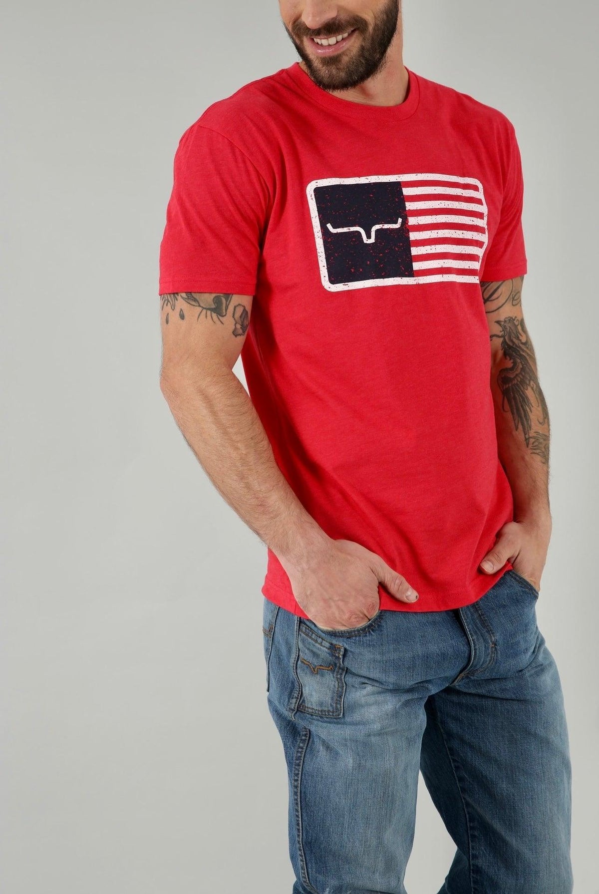 Kimes Ranch American Trucker Tee Shirt in Red with a distressed flag graphic featuring the Kimes Ranch logo