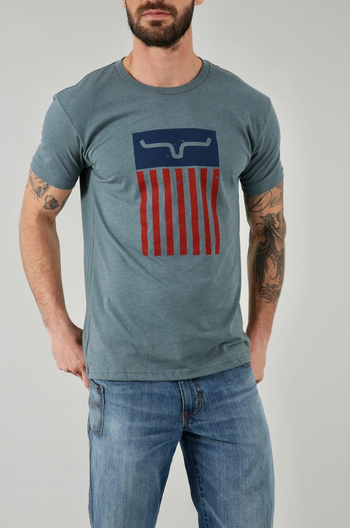 Kimes Ranch Cody Tee Shirt in blue with a graphic featuring the Kimes Ranch logo and red stripes