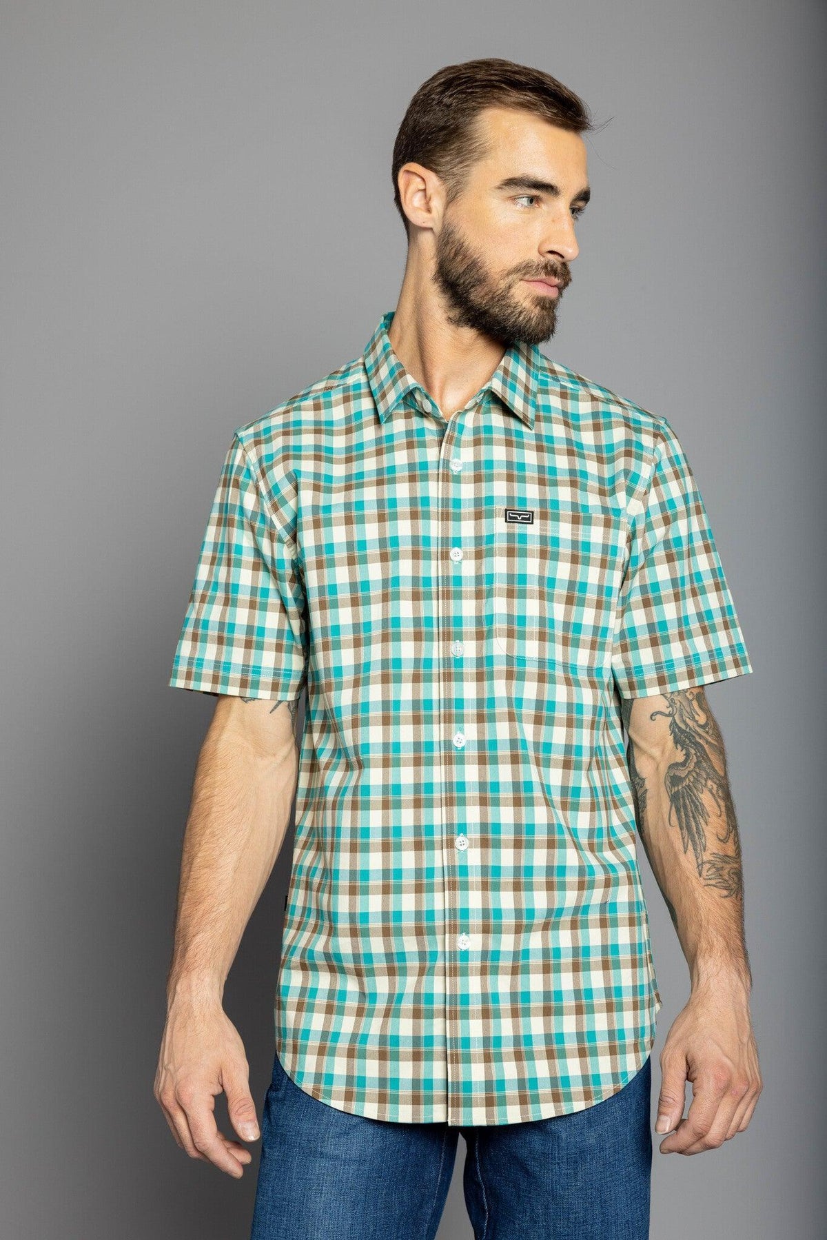 Kimes Ranch Go Round Plaid Dress Shirt in Teal with short sleeves and a chest pocket