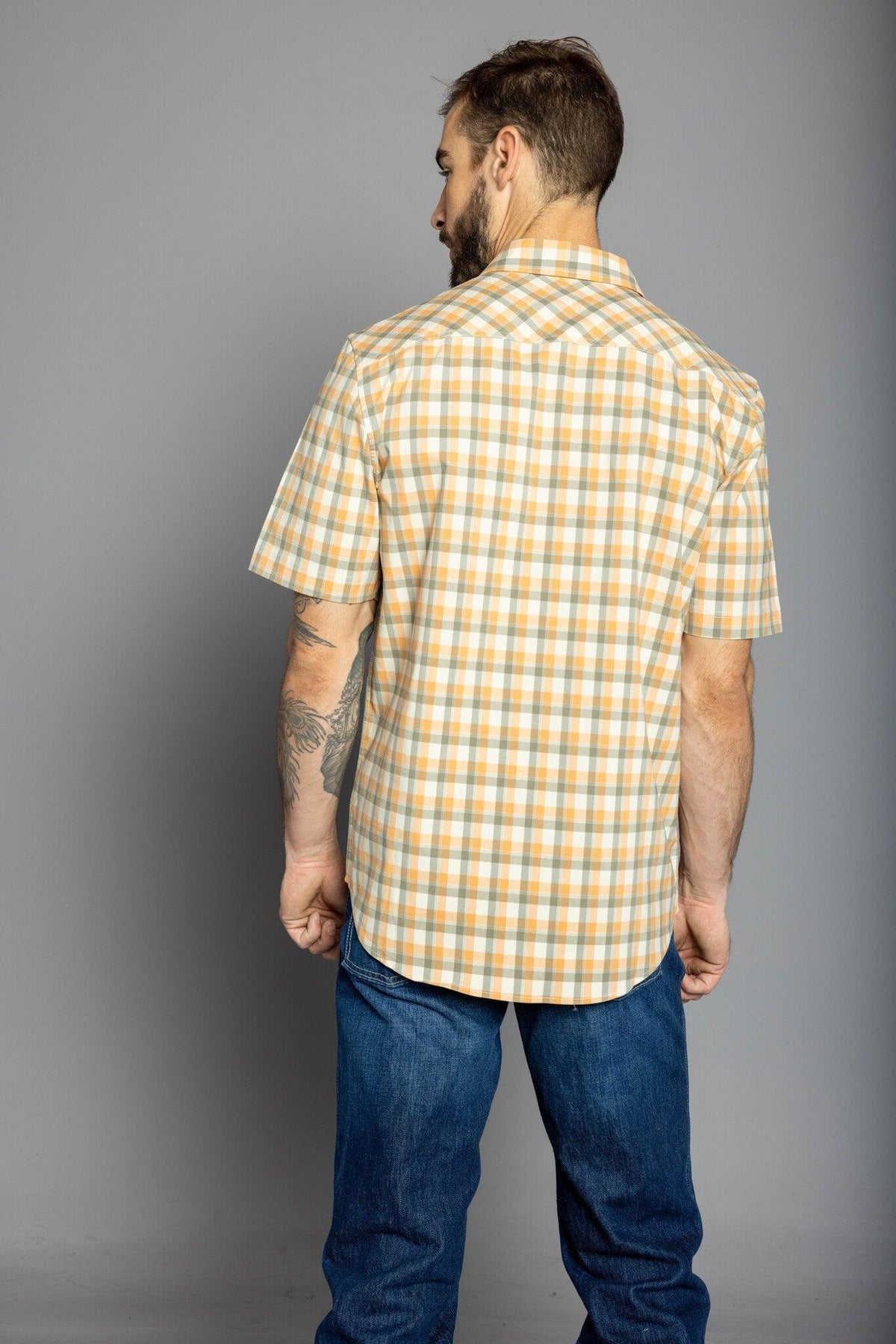 Kimes Ranch Go Round Plaid Dress Shirt in Gold, back view, with short sleeves and a checkered pattern