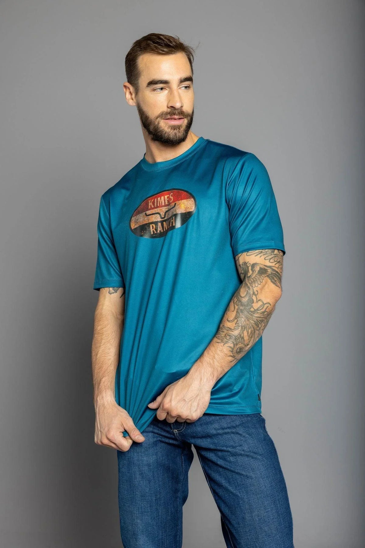 Kimes Ranch American Standard Tech T-Shirt in Dark Blue with a vintage oval Kimes Ranch logo on the chest
