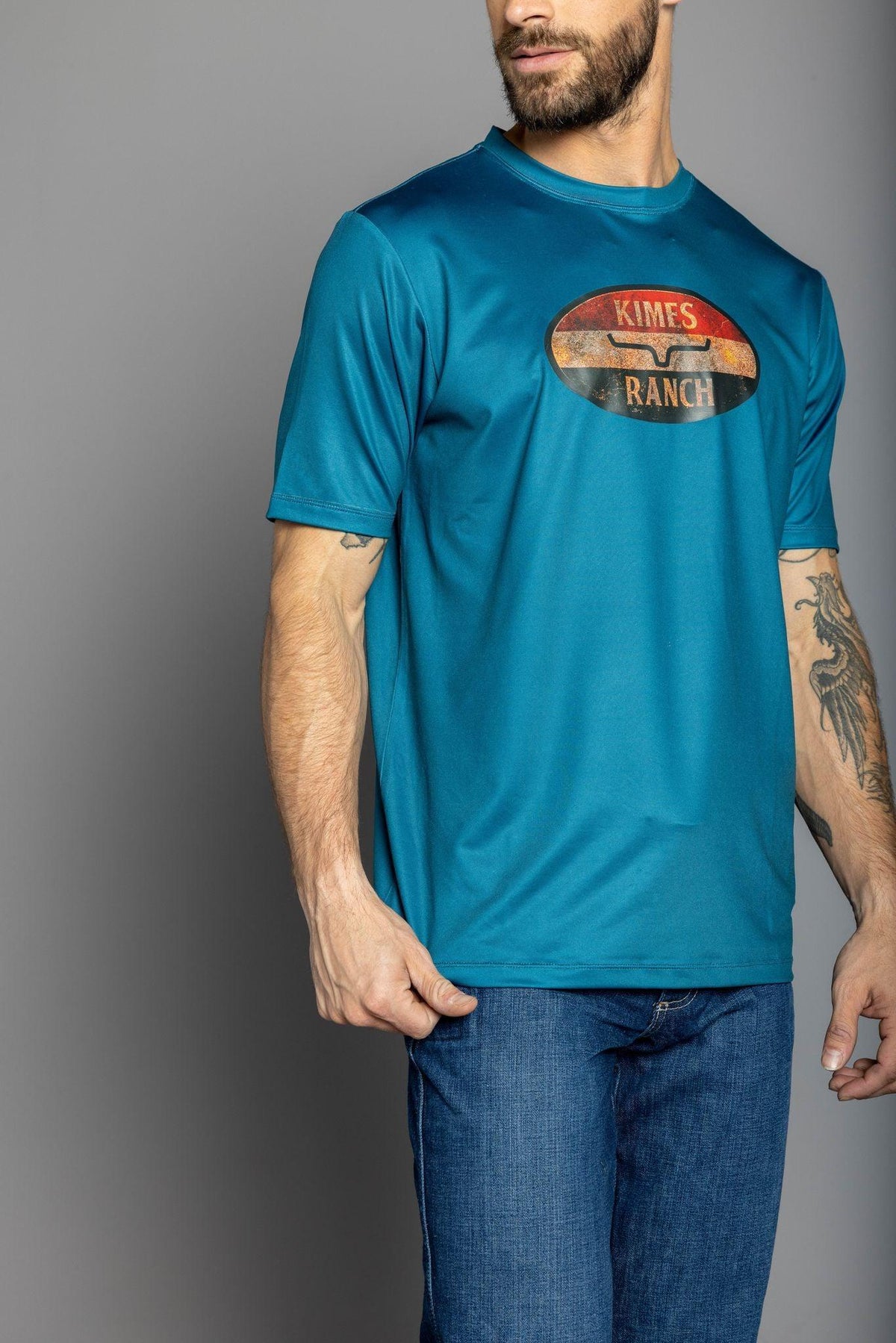 Kimes Ranch American Standard Tech T-Shirt in Dark Blue with a vintage oval Kimes Ranch logo on the chest