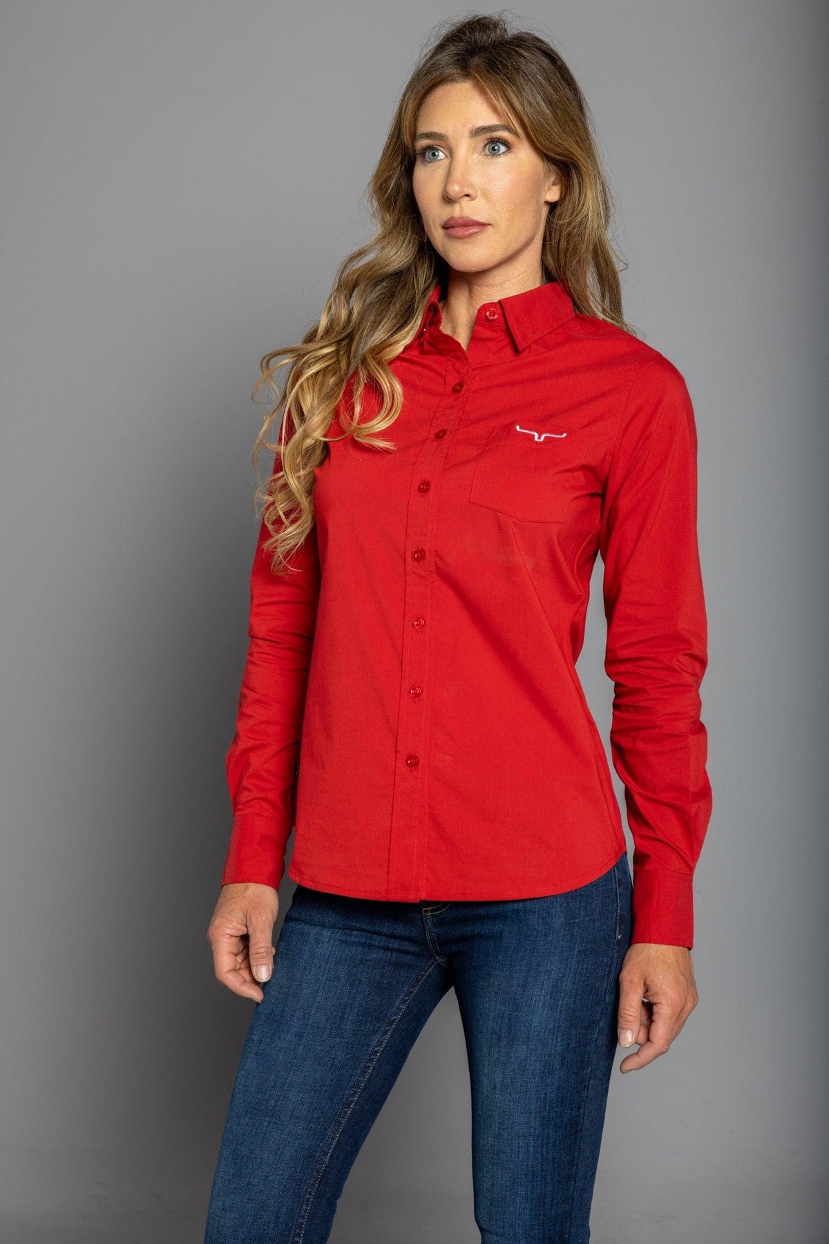 Kimes Ranch Ladies KR Team Shirt (Long) in Red with long sleeves, a button front, a chest pocket and the Kimes Ranch logo