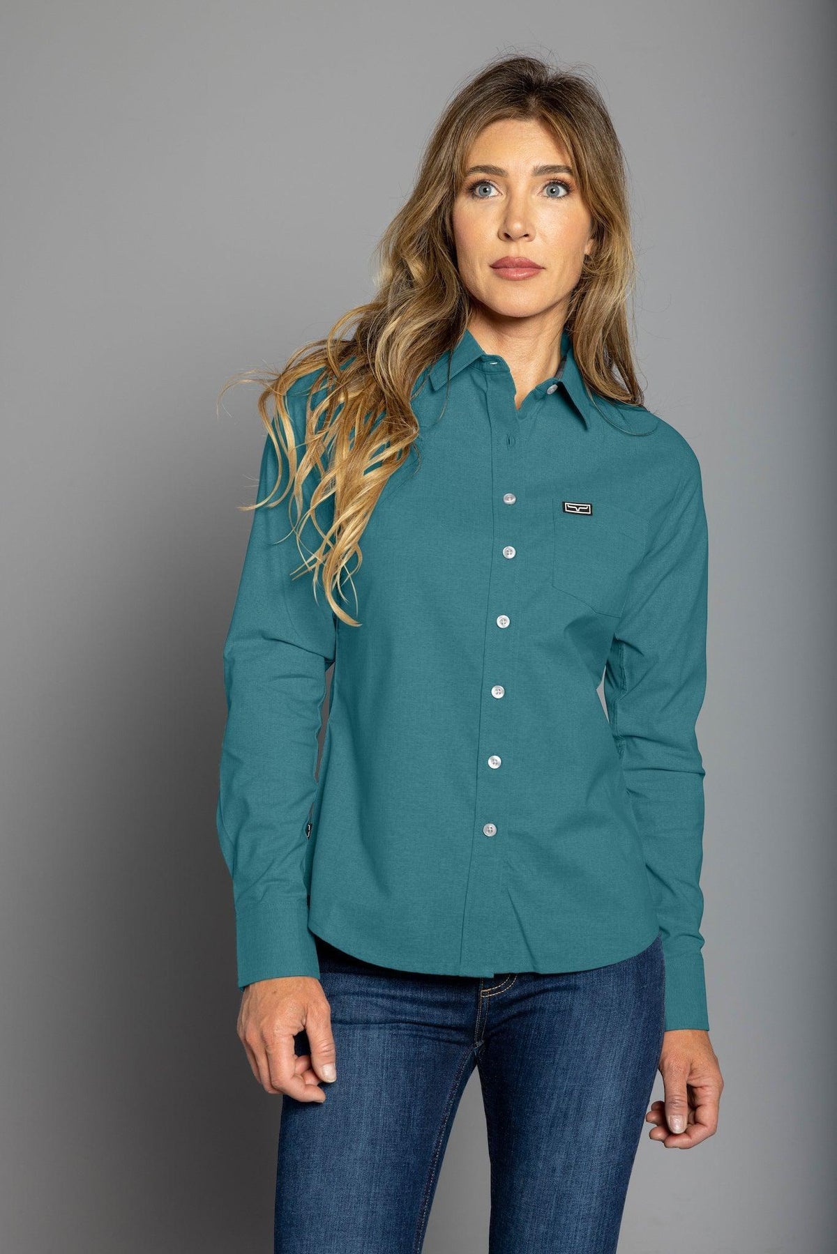 Kimes Ranch Ladies Linville long sleeve button top in Blue with a collar and chest pocket with logo