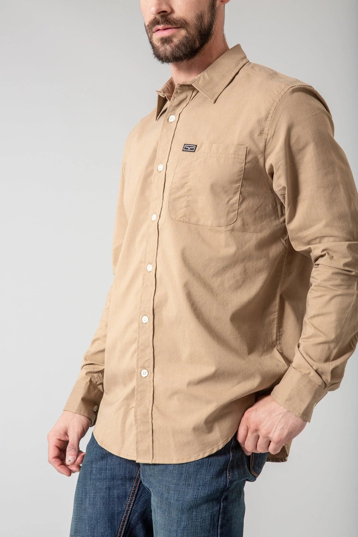 Kimes Ranch Linville Long Sleeve Dress Shirt in Tan, side view, with a button-down collar and chest pocket