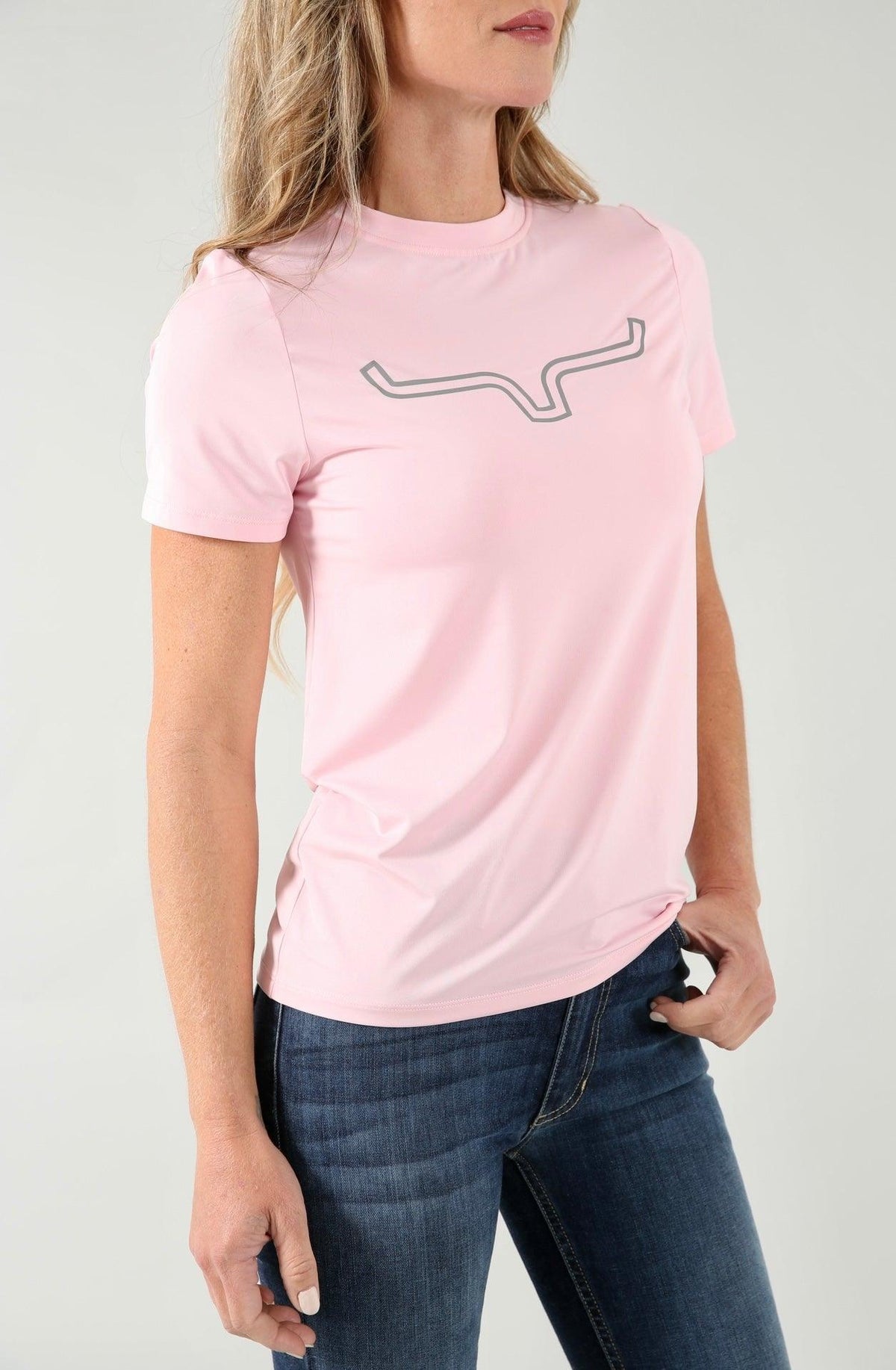 Kimes Ranch Ladies Outlier Tech Tee Shirt in Blush with a grey logo on the chest