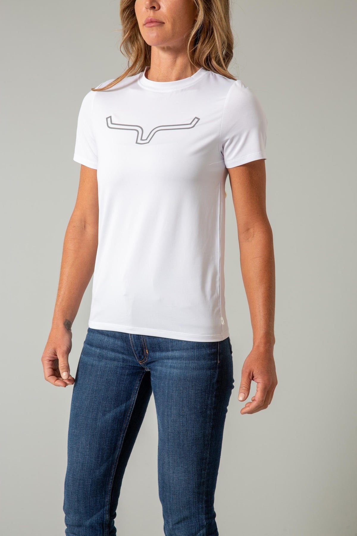 Kimes Ranch Ladies Outlier Tech Tee Shirt in White with a grey logo on the chest