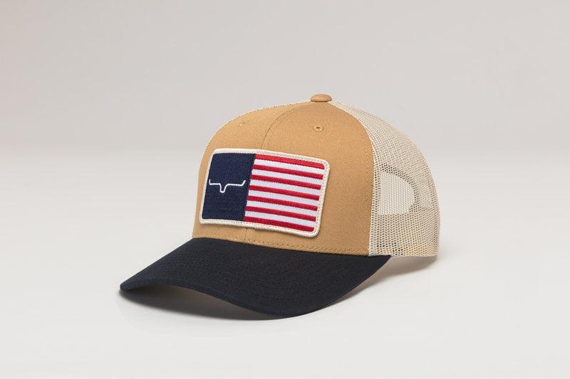 Kimes Ranch American Trucker Hat in Work Wear Brown, side view, with navy brim and embroidered flag patch with logo