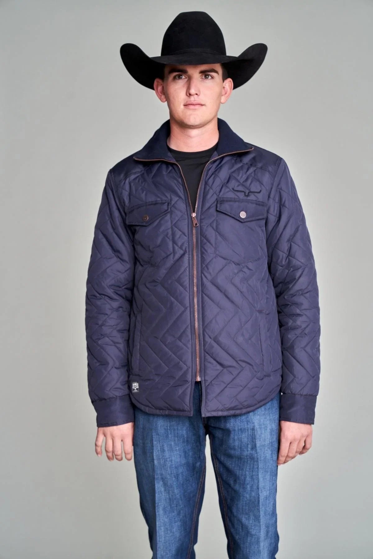 Kimes Ranch Skink Jacket in Navy with a diamond quilted pattern and two front flap pockets