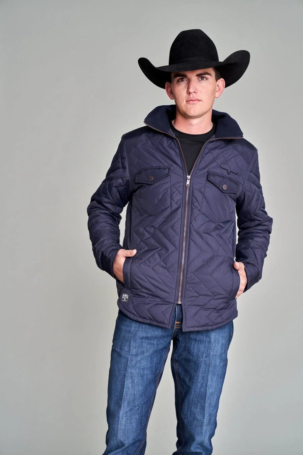 Kimes Ranch Skink Jacket in Navy with chevron quilting, zip front, and flap pockets