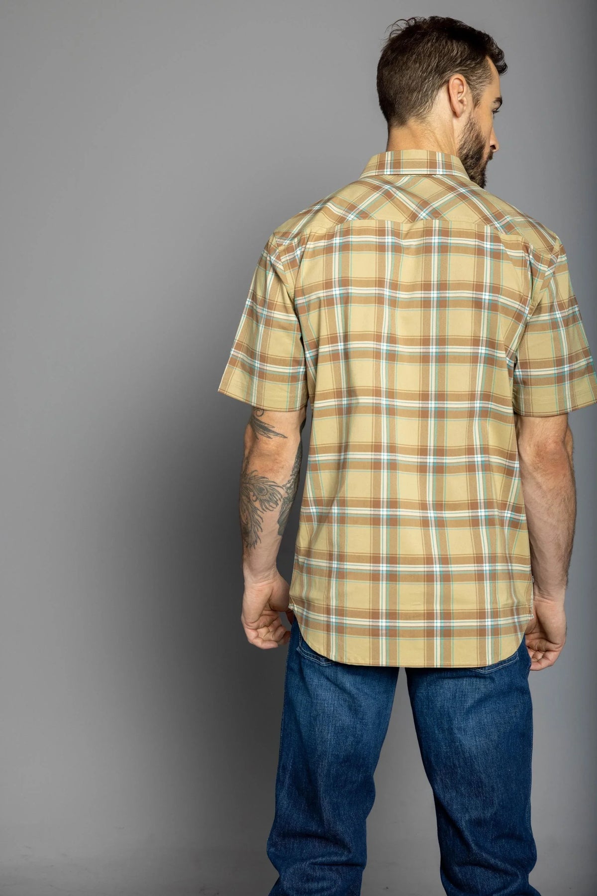 Kimes Ranch 4 Stroke Plaid Dress Shirt in Work Wear Brown, back view, with short sleeves and a plaid pattern