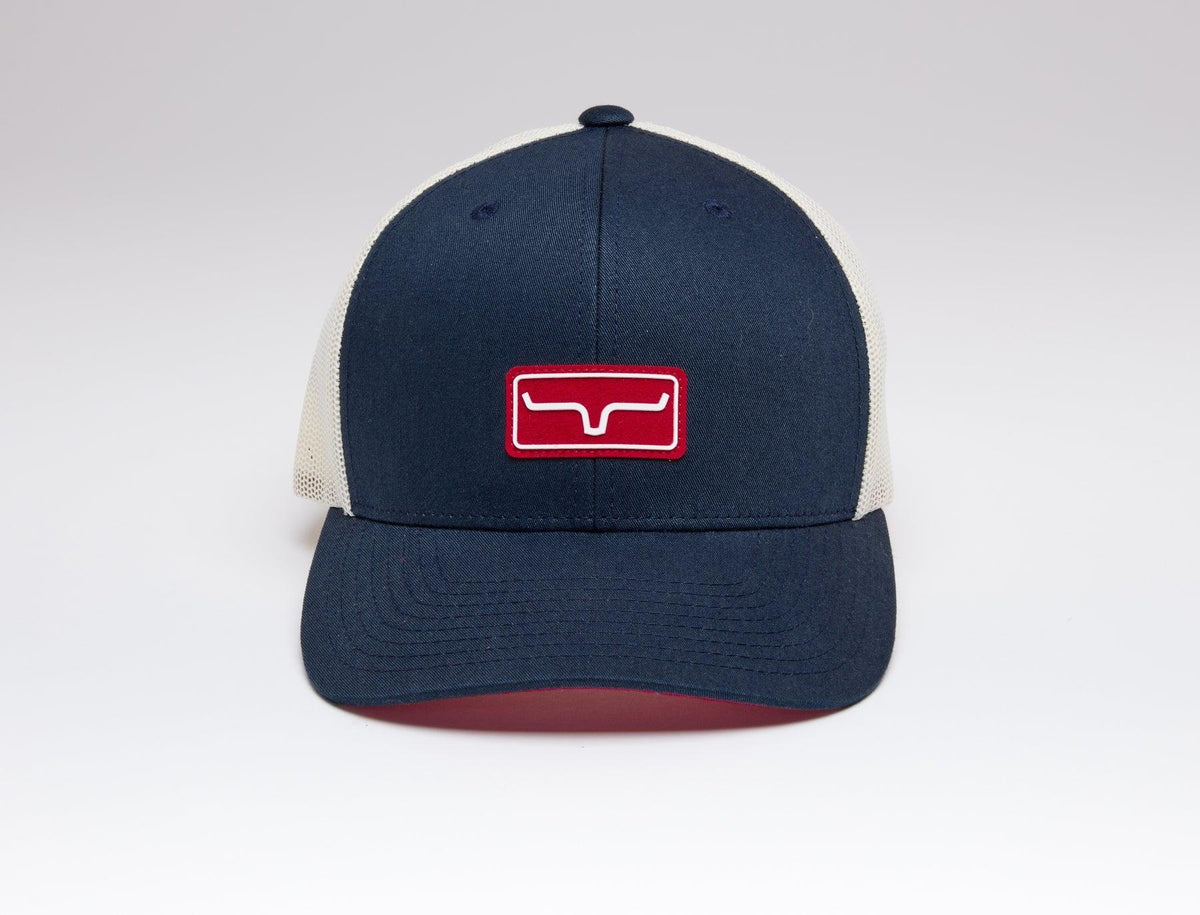 Kimes Ranch Team Pro Trucker Hat in navy with cream mesh back and red logo patch