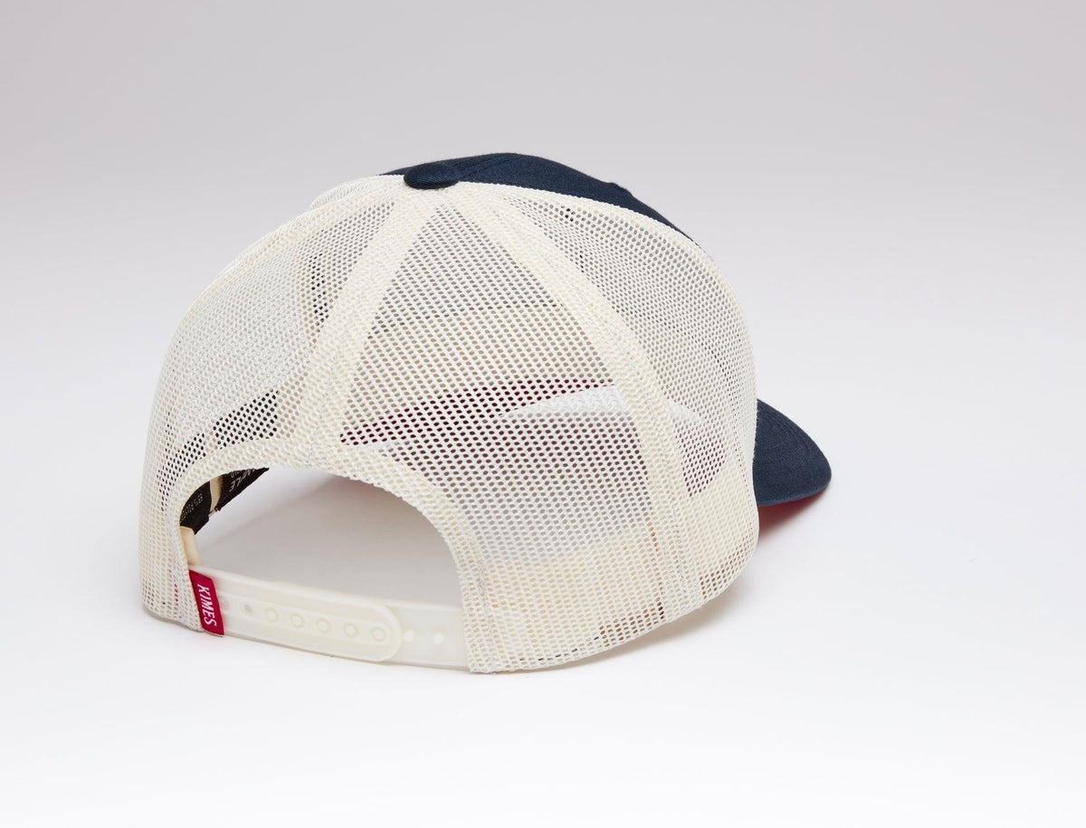Kimes Ranch Team Pro Trucker Hat, back view, in navy and cream with mesh back and adjustable strap
