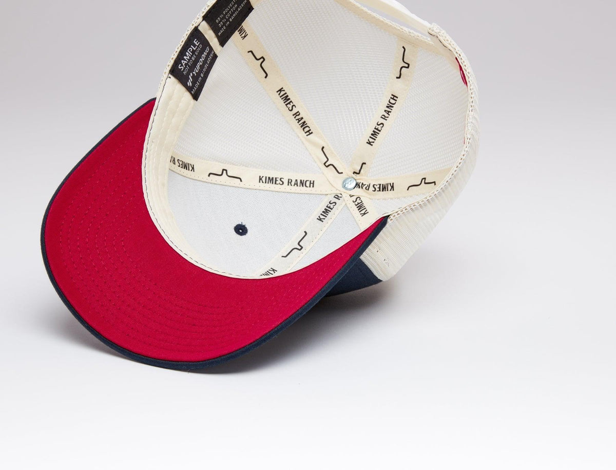 Kimes Ranch Team Pro Trucker Hat, close-up of red brim underside with navy trim and branded sweatband