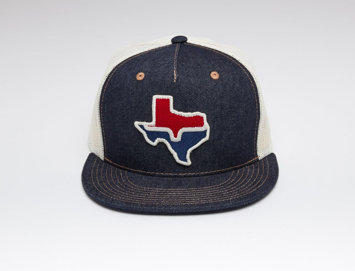 Kimes Ranch Texas Trucker Hat with embroidered Texas state outline in red and blue on navy front with cream mesh back