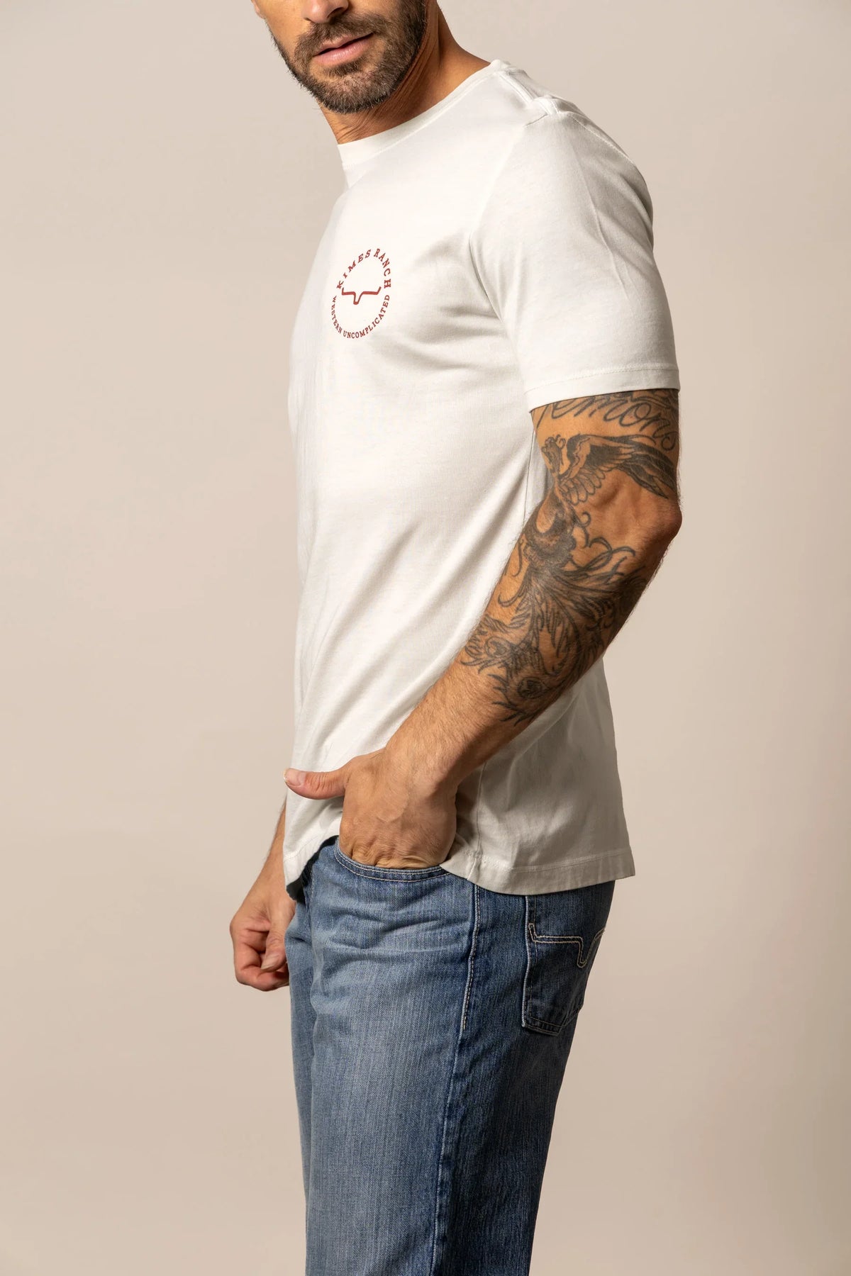 Kimes Ranch 1956, side view, Natural short sleeve shirt with a small chest logo