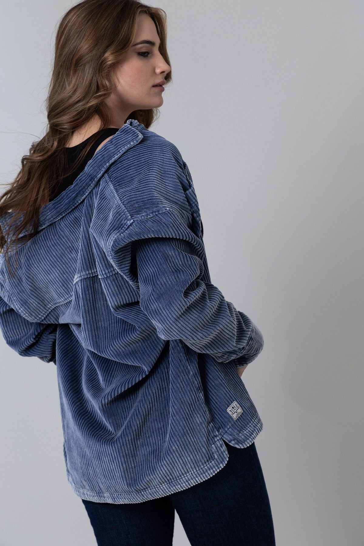 Kimes Ranch Luna Cord top in Slate, side view, with a hood and side patch
