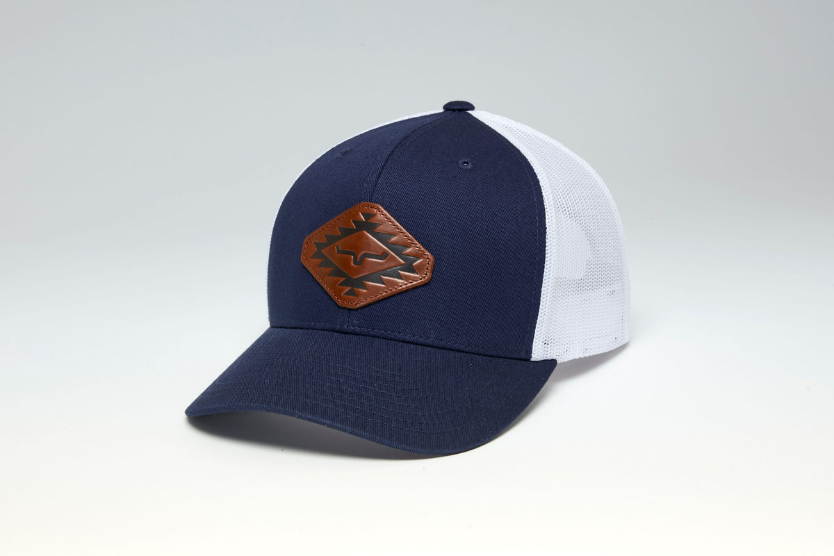 Kimes Ranch San Juan hat in Navy, side view, with a brown logo patch and white mesh back