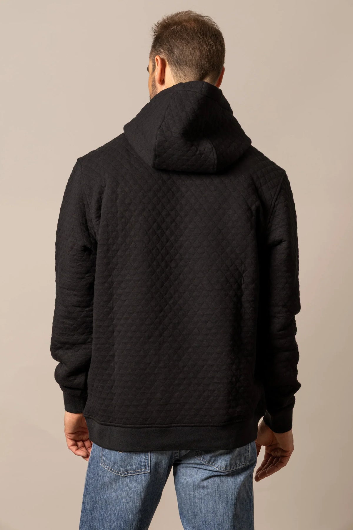 Kimes Ranch AF Ripon Hoodie in Black, back view, with a diamond quilted back and hood