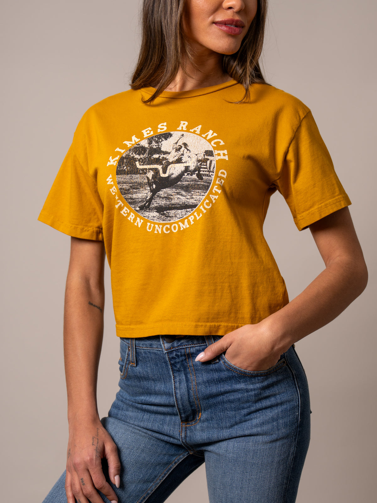 Kimes Ranch Afternoon Rodeo shirt in Gold with a vintage rodeo graphic and Western Uncomplicated text