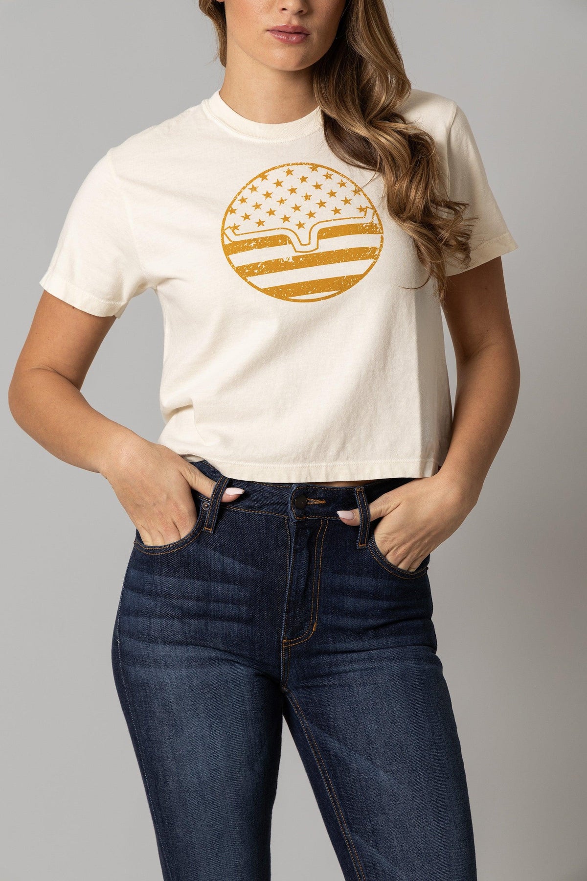 Kimes Ranch Ladies American Bullseye Crop shirt in Ivory with a gold bullseye graphic