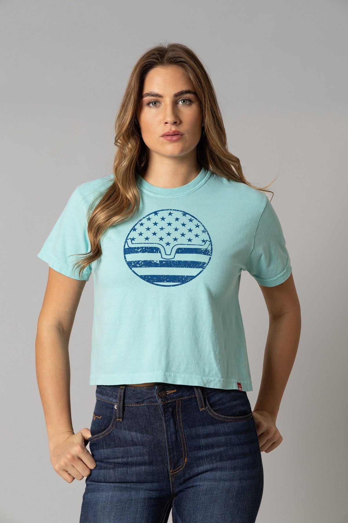 Kimes Ranch Ladies American Bullseye Crop shirt in Mint with a distressed blue circular graphic featuring stars and stripes