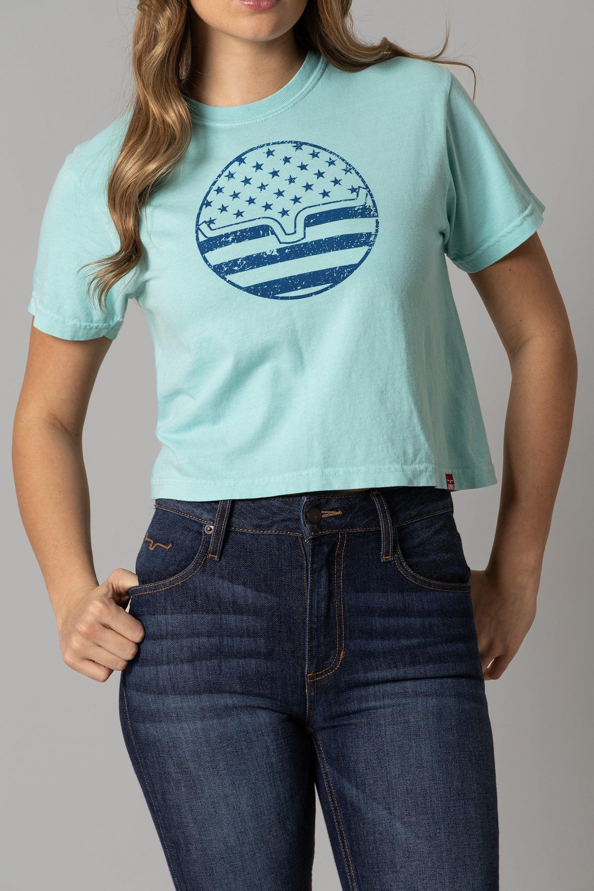 Kimes Ranch Ladies American Bullseye Crop shirt in Mint with a distressed blue circular graphic of stars and stripes