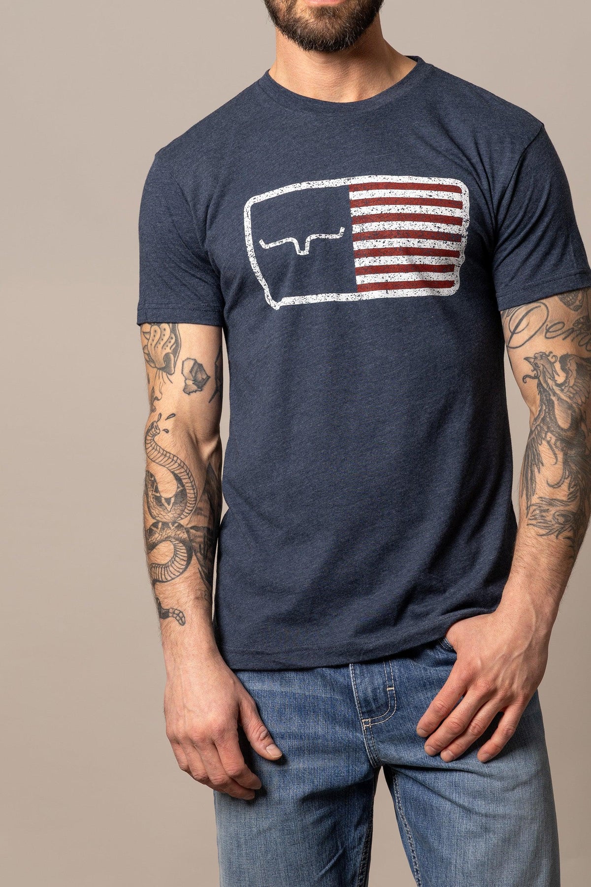 Kimes Ranch American Trucker Tee Shirt in Navy with a graphic of a the Kimes Ranch logo and American flag stripes