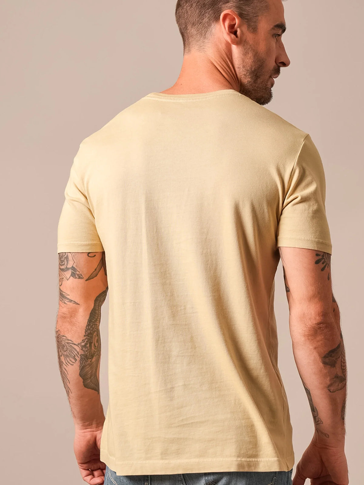 Kimes Ranch Americana 59 shirt in Sand, back view, with short sleeves and a crew neck