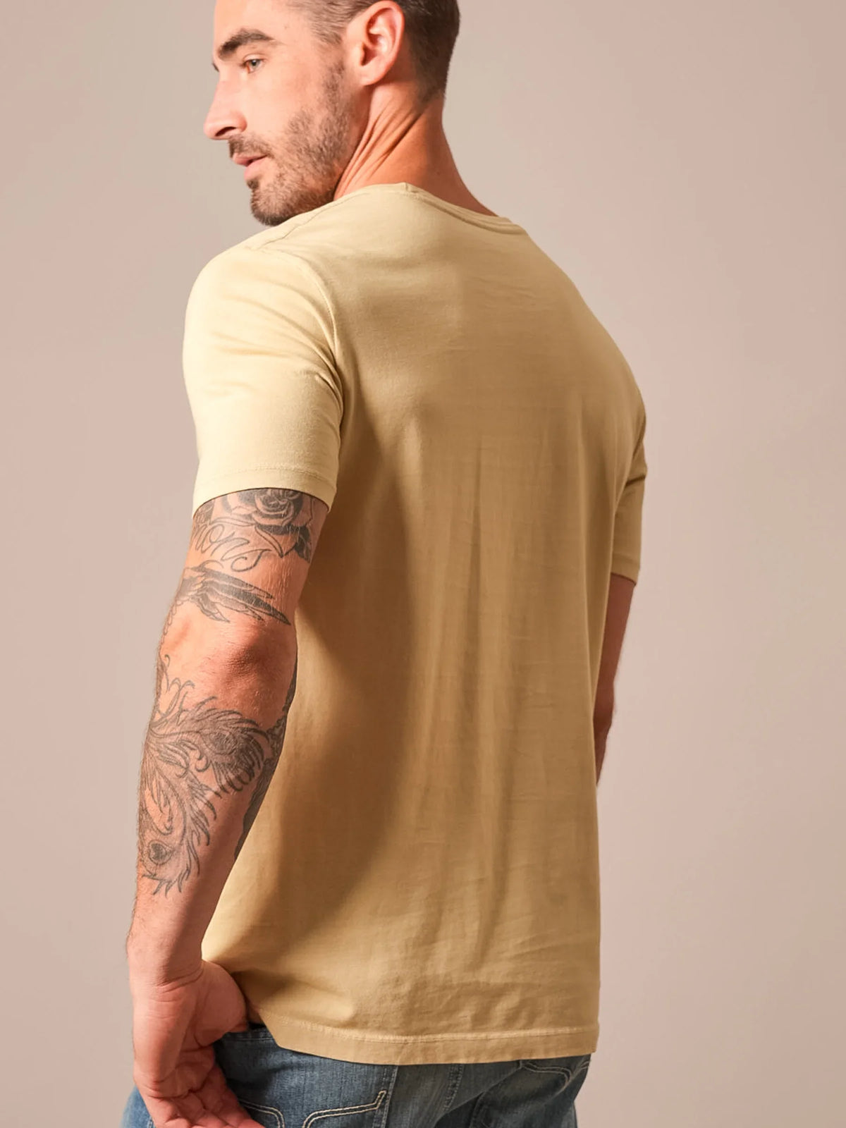 Kimes Ranch Americana 59 shirt in Sand, side view, with short sleeves and a crew neckline