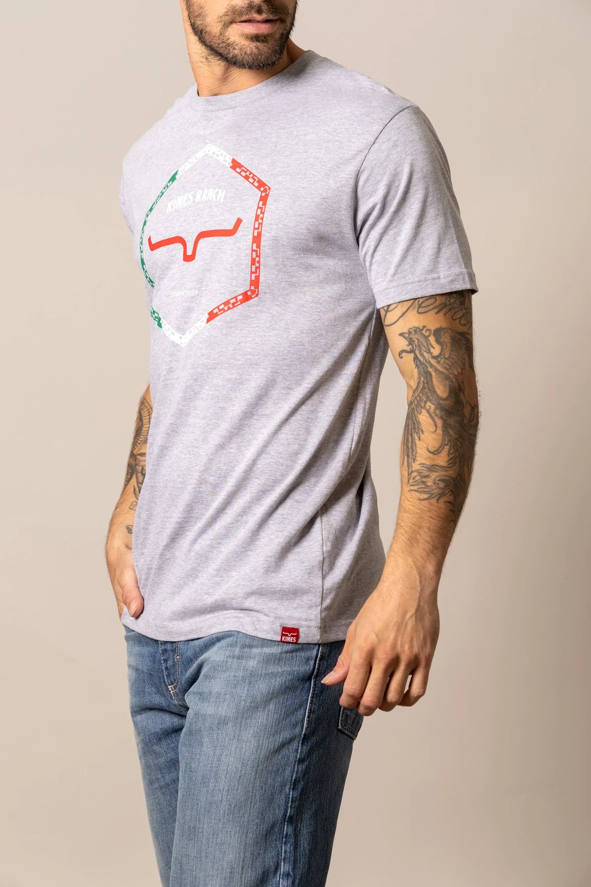 Kimes Ranch Baja Diamond, side view, short sleeve shirt in grey with a hexagonal graphic print featuring a steer logo