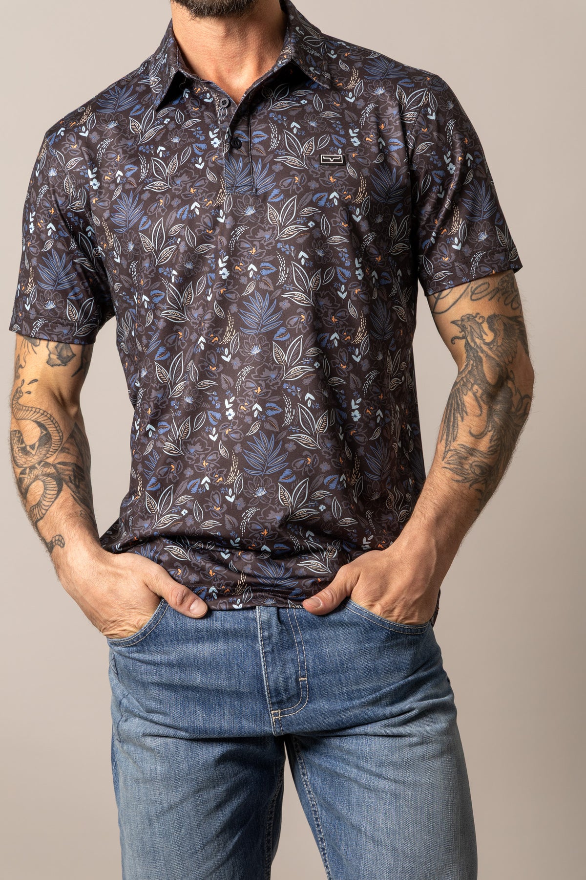 Kimes Ranch Bartram polo shirt in Black with a blue and white floral print and a logo on the chest