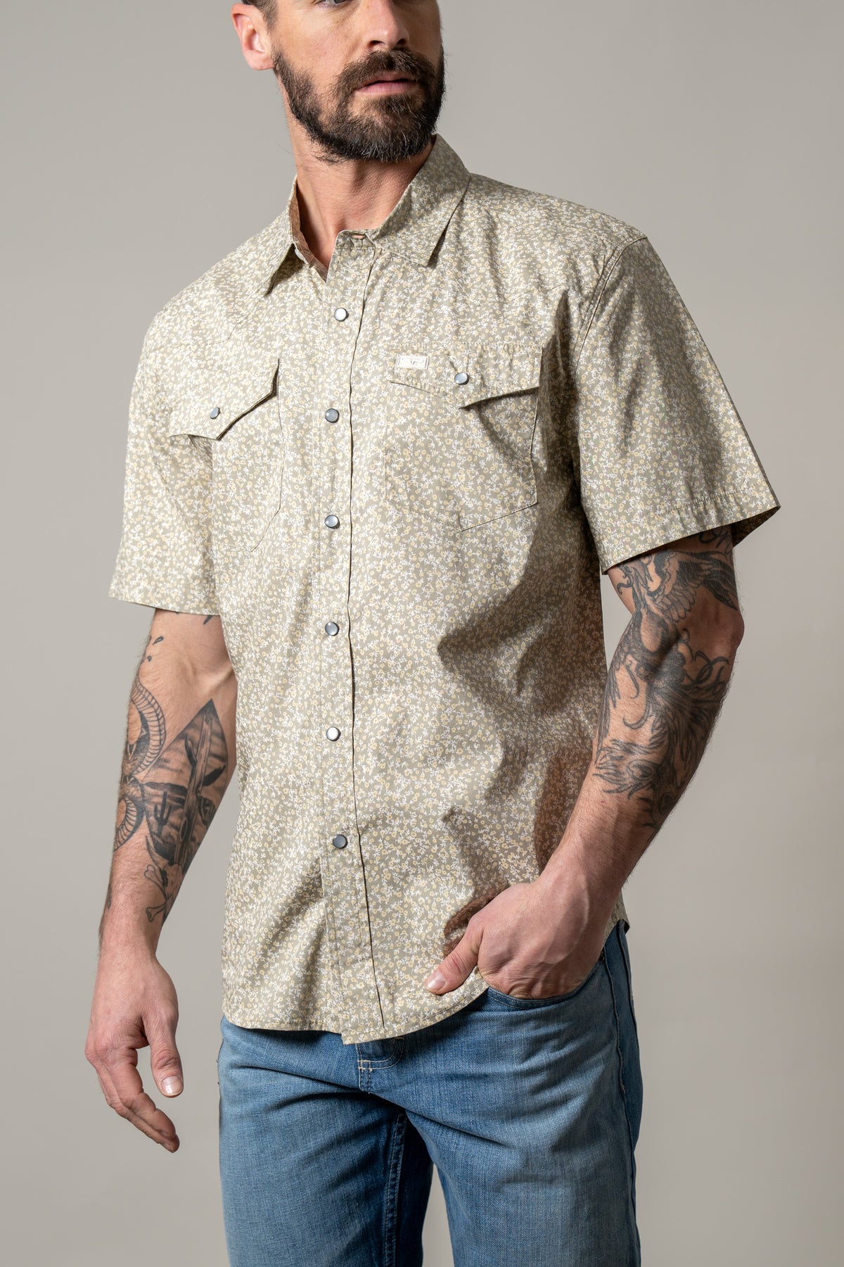 Kimes Ranch Bascom short sleeve dress shirt in Sage with a small floral print and two button flap chest pockets