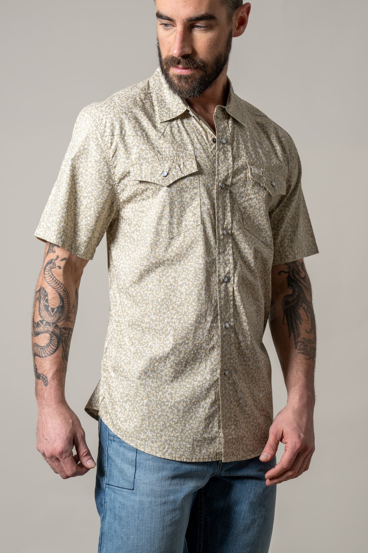 Kimes Ranch Bascom short sleeve dress shirt in Sage with a small floral print and two button flap chest pockets