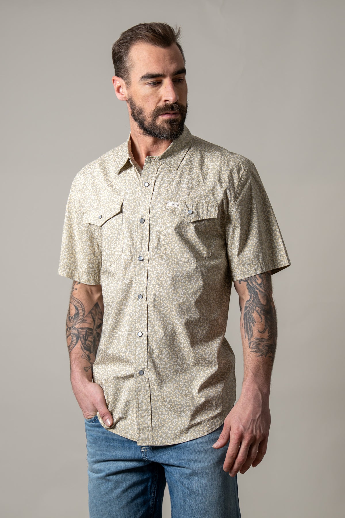 Kimes Ranch Bascom short sleeve dress shirt in Sage with a small floral print and two button flap chest pockets