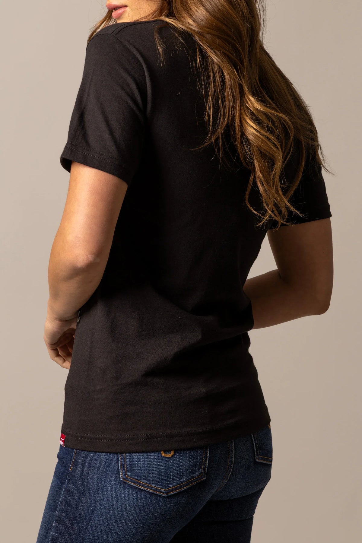 Kimes Ranch Be Kimes shirt in Black, back view, with short sleeves and a red tag at the hem