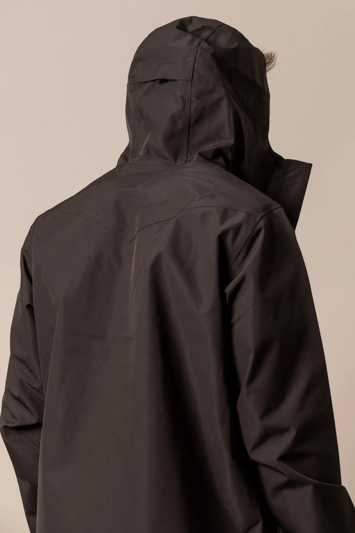 Kimes Ranch Beartooth Shell jacket in Black, back view, with a hooded back yoke and long sleeves