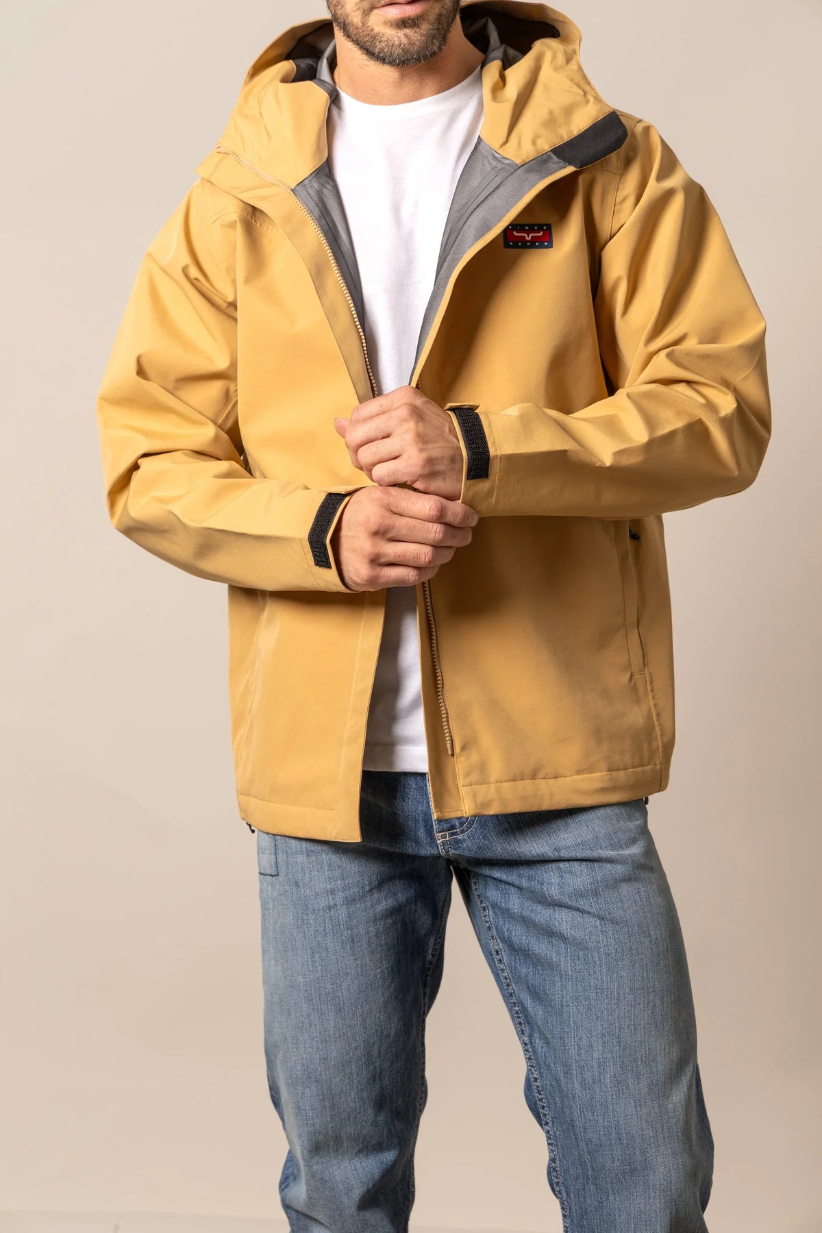 Kimes Ranch Beartooth Shell jacket in Work Wear Brown with a hood and Kimes Ranch logo