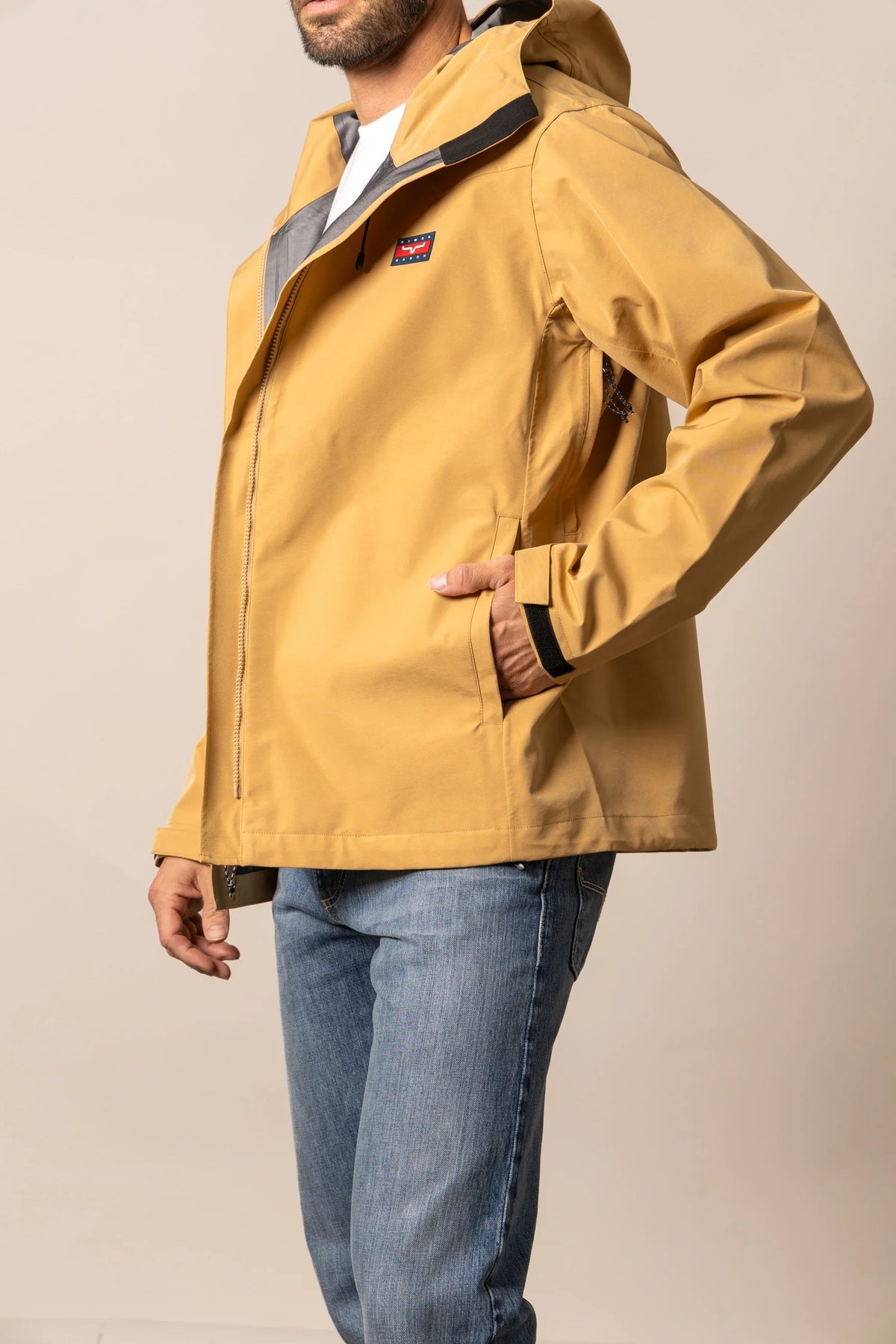 Kimes Ranch Beartooth Shell jacket in Work Wear Brown, side view, with a hood and front zip