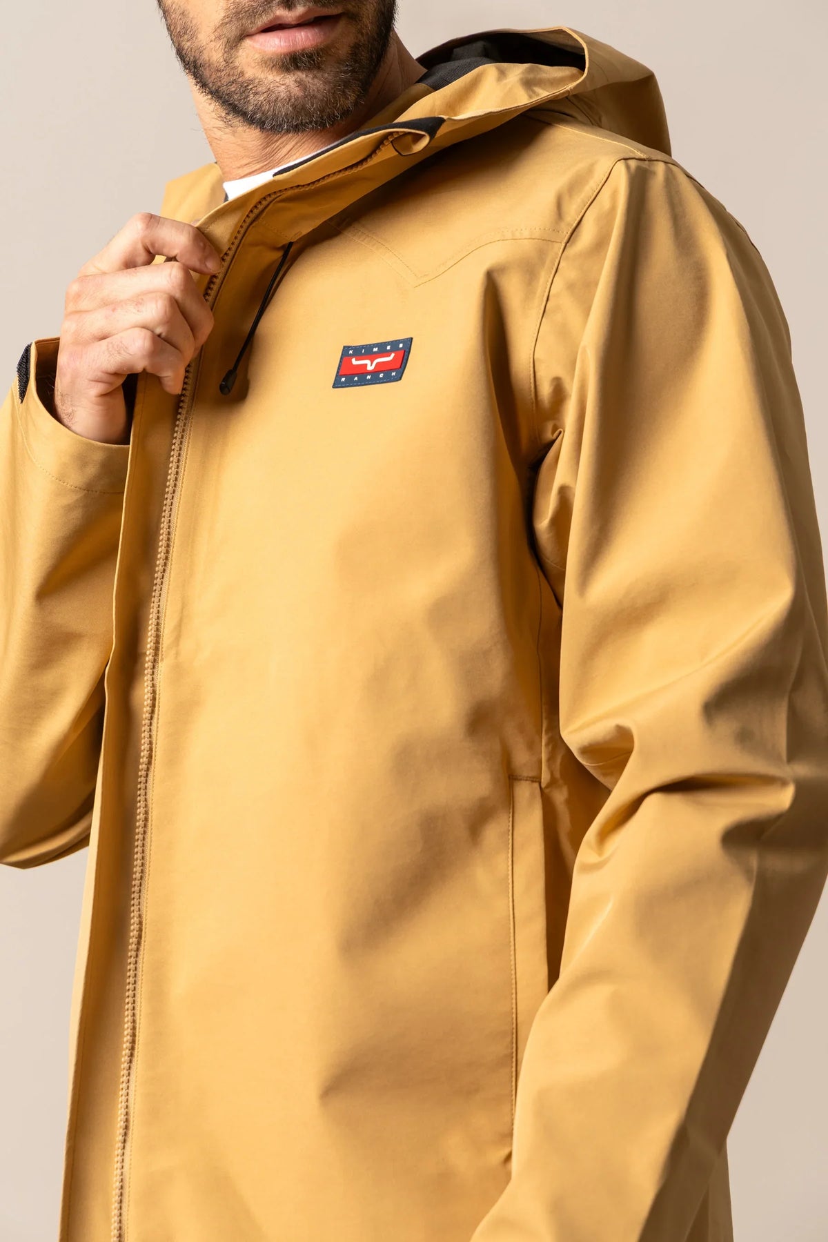 Kimes Ranch Beartooth Shell jacket in Work Wear Brown with a front zip and chest logo