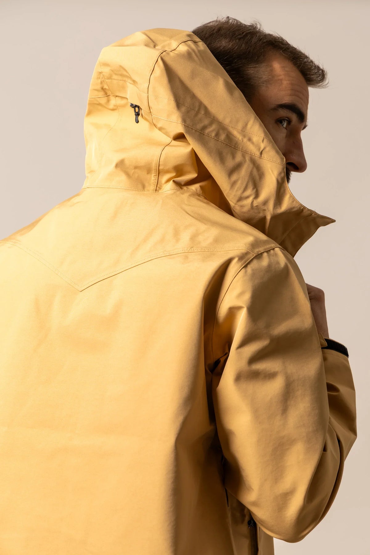 Kimes Ranch Beartooth Shell jacket in Work Wear Brown, side view, with a hood and back yoke