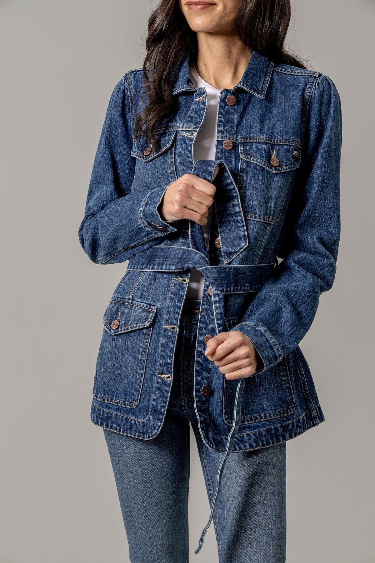 Kimes Ranch Becca Denim Jacket in Antique Wash with button front, chest pockets, and a belted waist