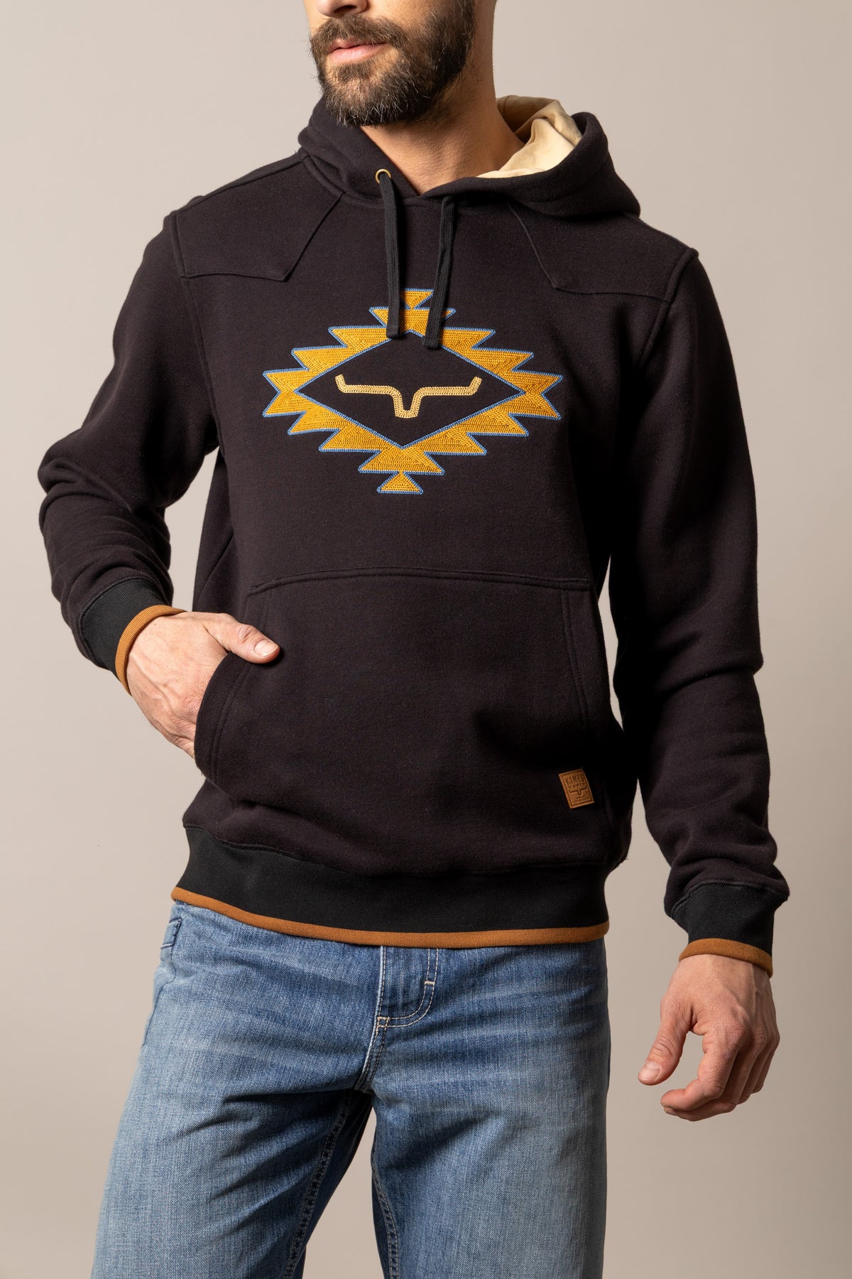 Kimes Ranch Berger hoodie in Black with a front kangaroo pocket and a large embroidered geometric Kimes Ranch logo