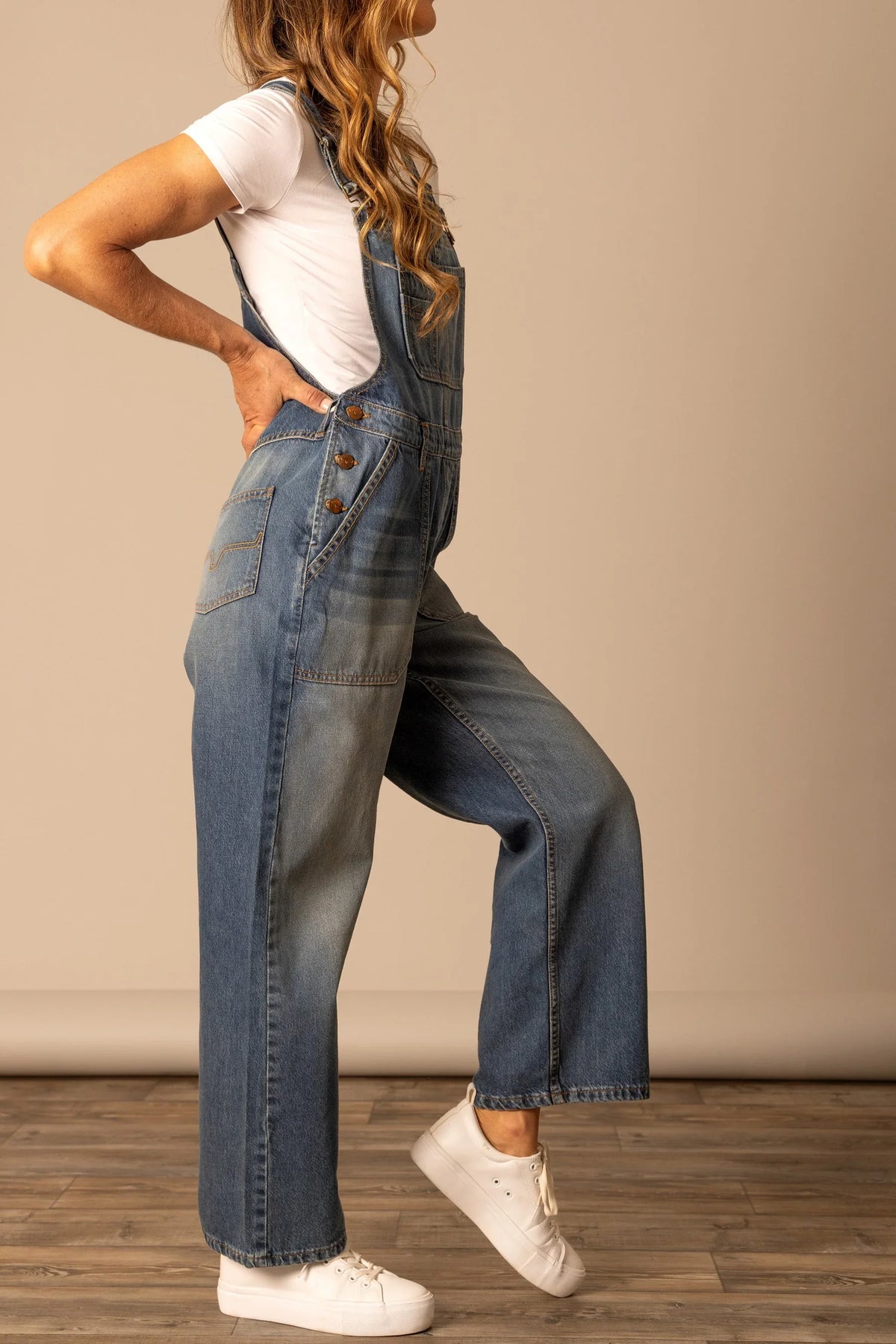 Kimes Ranch Billy Overalls in Dark Wash, side view, with front button closure and wide leg silhouette