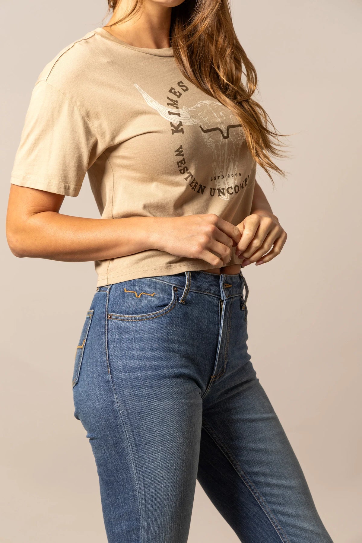 Kimes Ranch Bison Skull shirt in Tan, side view, with a graphic of a steer skull and the words KIMES WESTERN UNCOMP