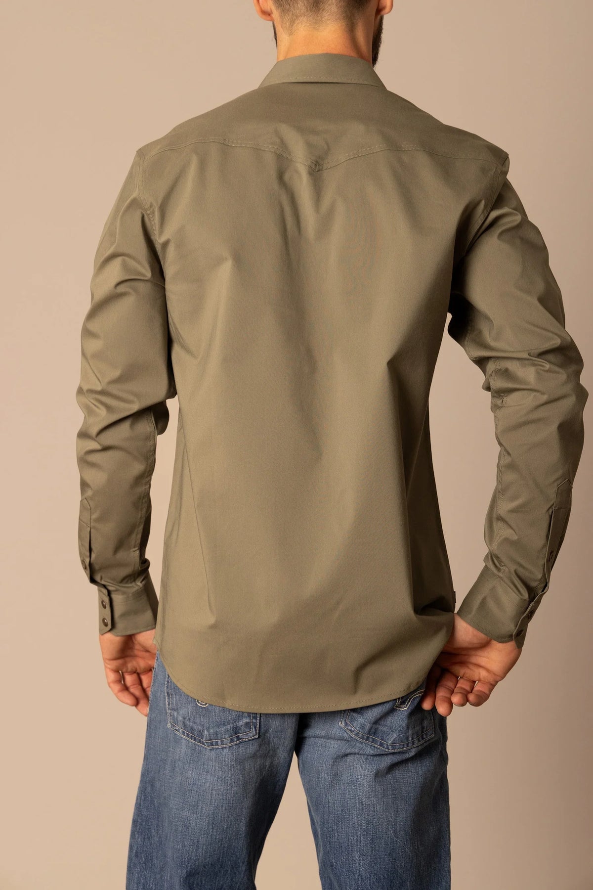 Kimes Ranch Blackout Dress Shirt in Army, back view, with a back yoke and buttoned cuffs